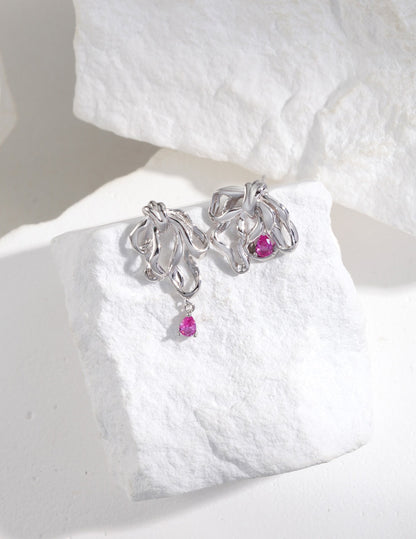 ribbon design asymmetric earrings, S925 silver ribbon earrings, asymmetric gemstone earrings, cubic zirconia jewelry, modern elegant earrings, artistic silver earrings