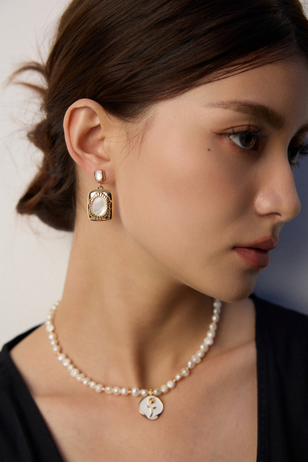 vintage mother of pearl earrings, 925 sterling silver pearl earrings, artisanal pearl earrings, classic pearl jewelry, elegant shell earrings, timeless pearl design, 