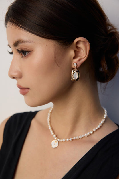 vintage mother of pearl earrings, 925 sterling silver pearl earrings, artisanal pearl earrings, classic pearl jewelry, elegant shell earrings, timeless pearl design, 