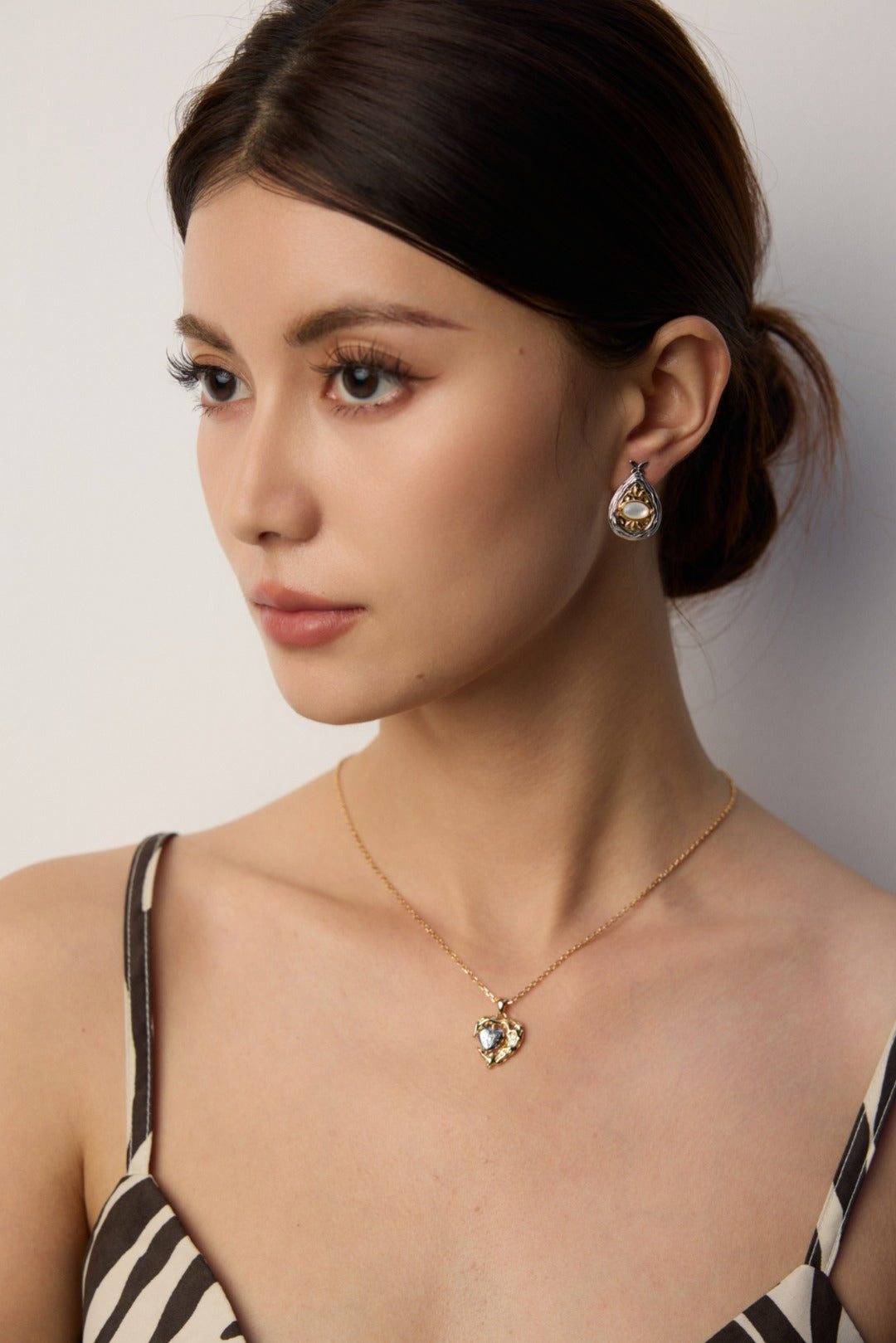 S925 silver mother of pearl & Lapis Lazuli Earrings, S925 silver mother of pearl & Lapis Lazuli Earrings showcased on a model with a matching necklace.